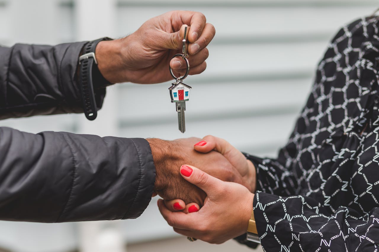 Man handing over house keys